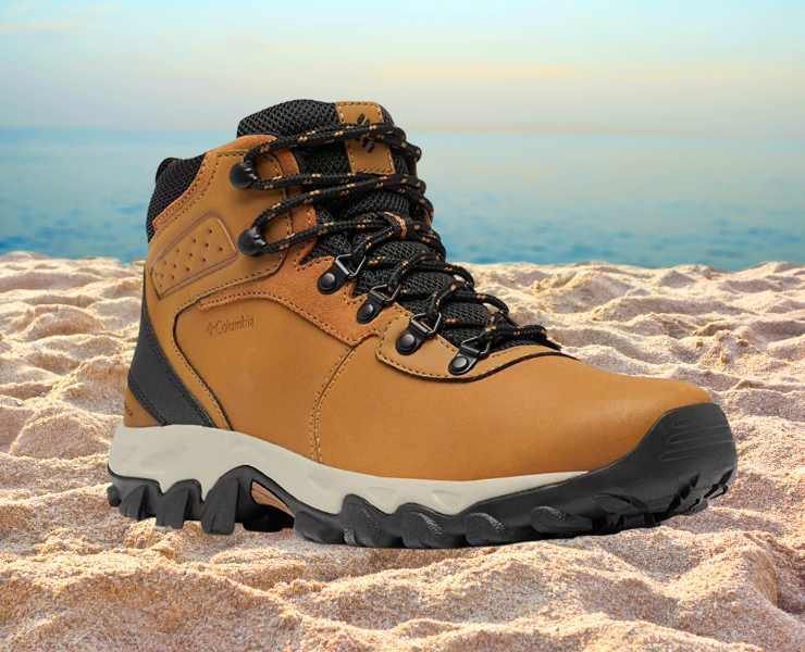 Side view of Columbia Men's Newton Ridge Plus II Waterproof Hiking Boot on beach sand