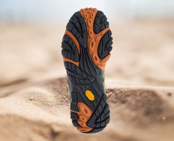 Sole View of Merrell Men's Moab 2 Vent Hiking Shoes on sand dune