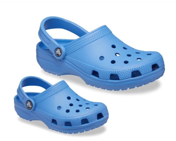 Top side view of Crocs Unisex-Adult and Kids Classic Clogs, Blue Bolt color. Image credit: CROCS