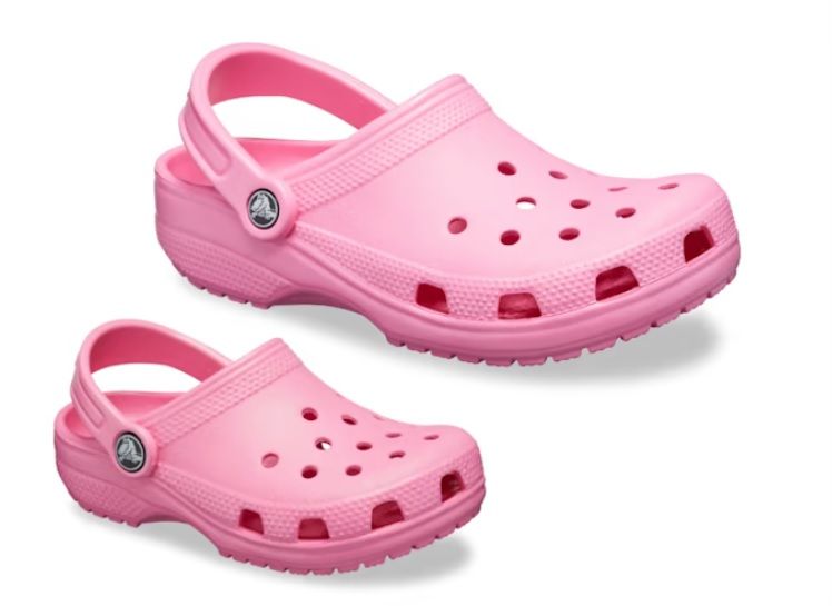 Top side view of Crocs Unisex-Adult and Kids Classic Clogs, Taffy Pink color. Image credit: CROCS